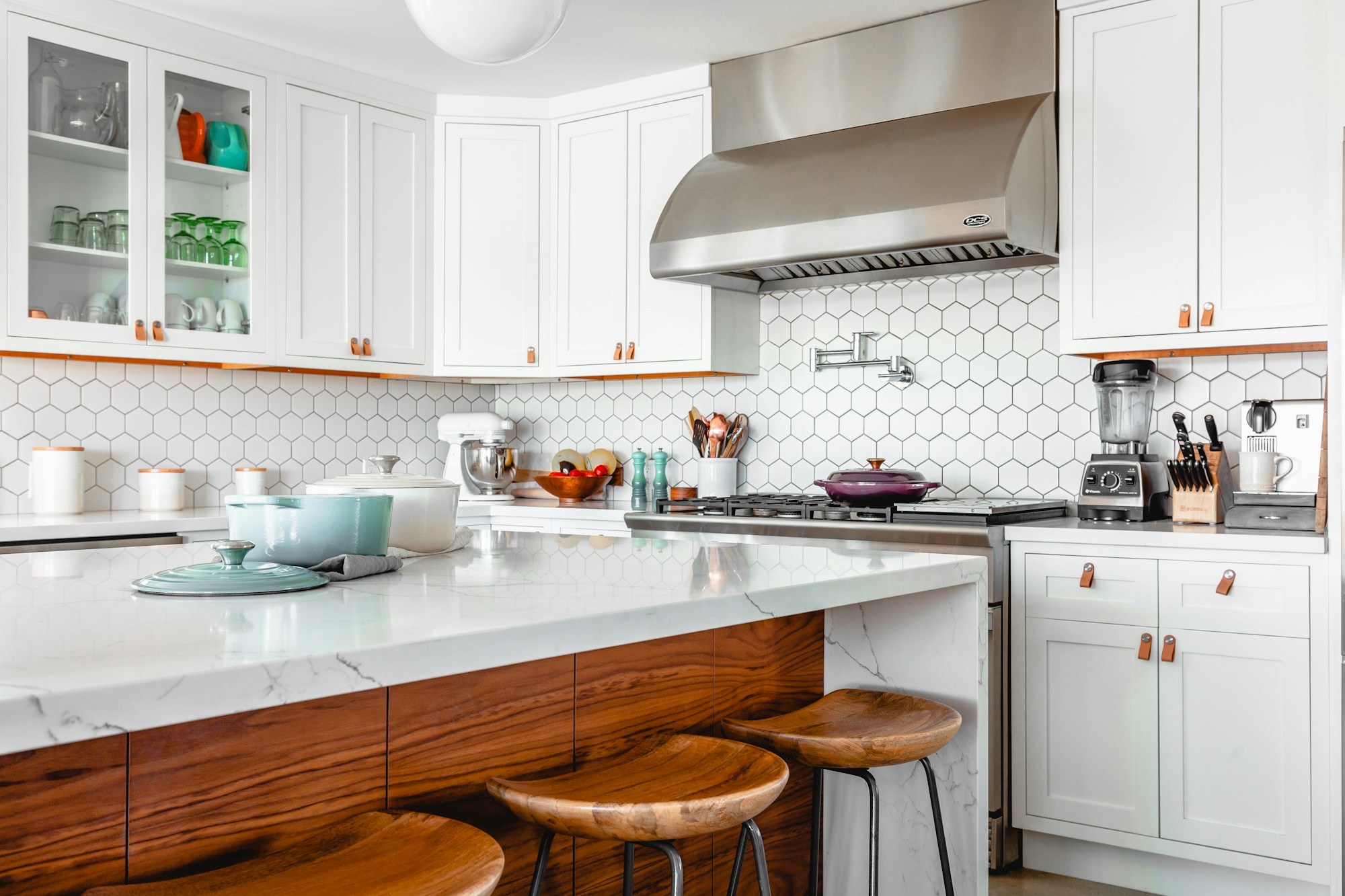 Bright kitchen with natural wood cabinetry and modern appliances